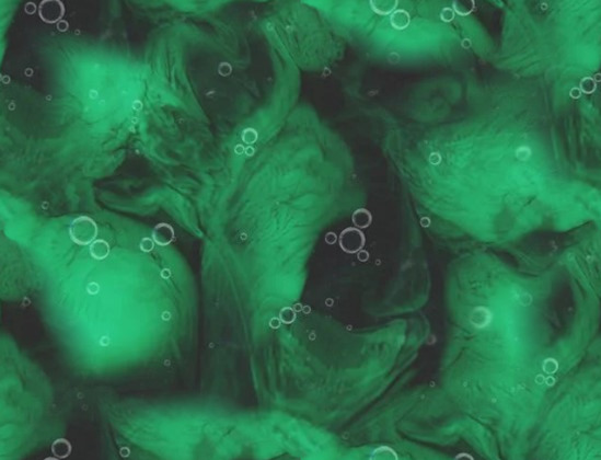 Green and black swirls with small bubbles scattered throughout